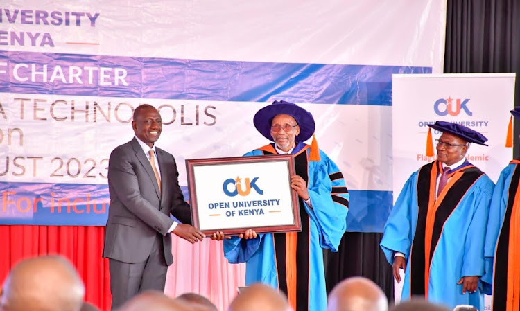 File image of President William Ruto awarding a charter to the Open University of Kenya.